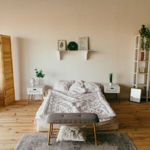 Elegant modern bedroom featuring wooden elements, soft lighting, and minimalist design. Perfect for interior inspiration.